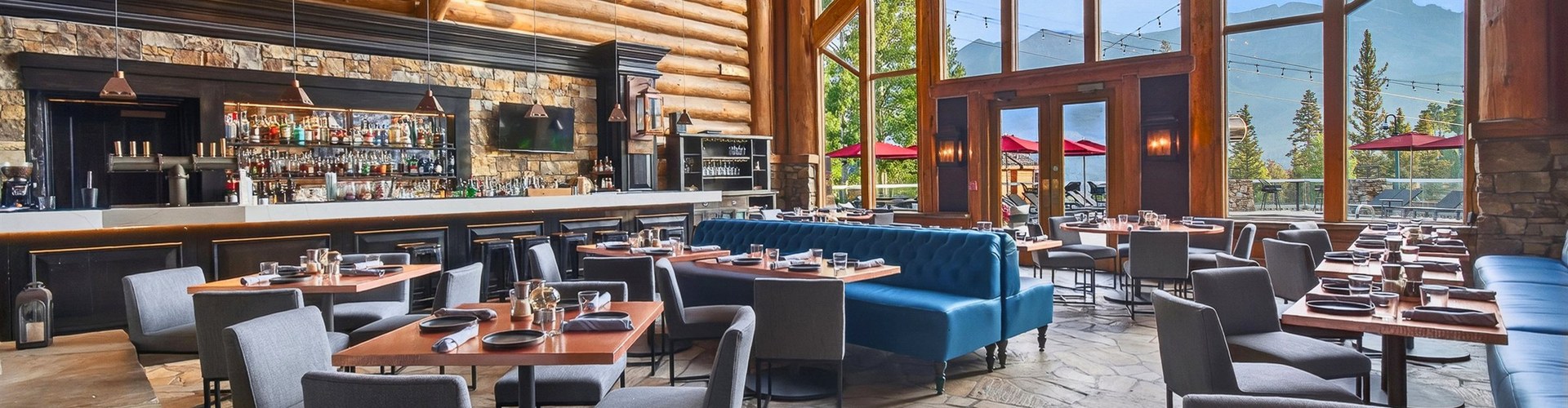 Alloy Kitchen dining room at Mountain Lodge Telluride with blue banquettes and mountain views