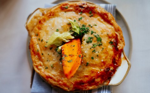 a pie with a piece of food on top