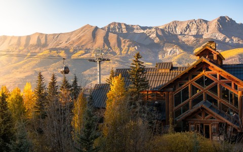 a house with a cable car in the background