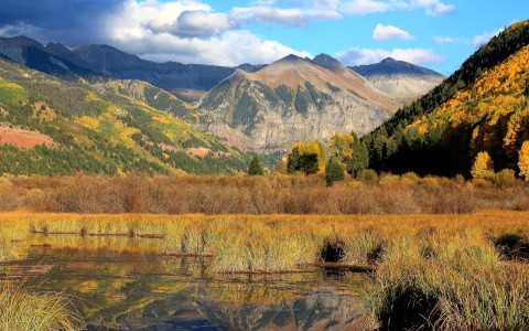 a lake with mountains in the background