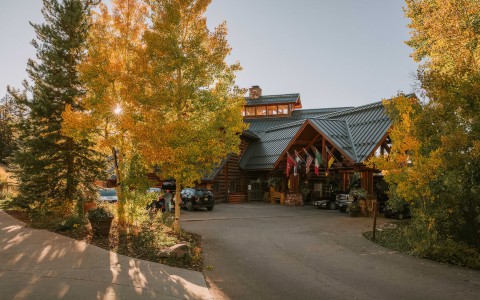 a building with trees and flags