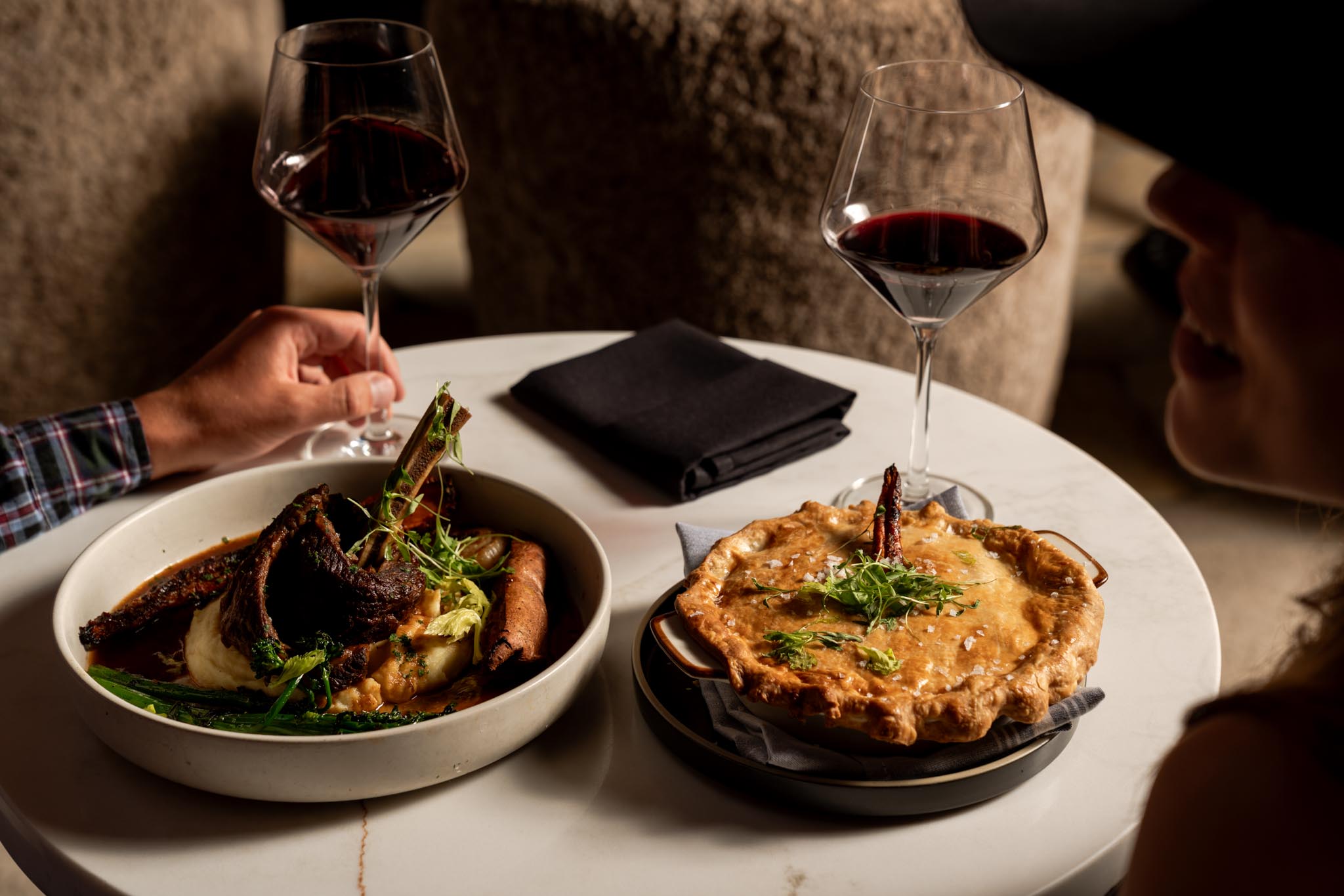a plate of food and a glass of wine