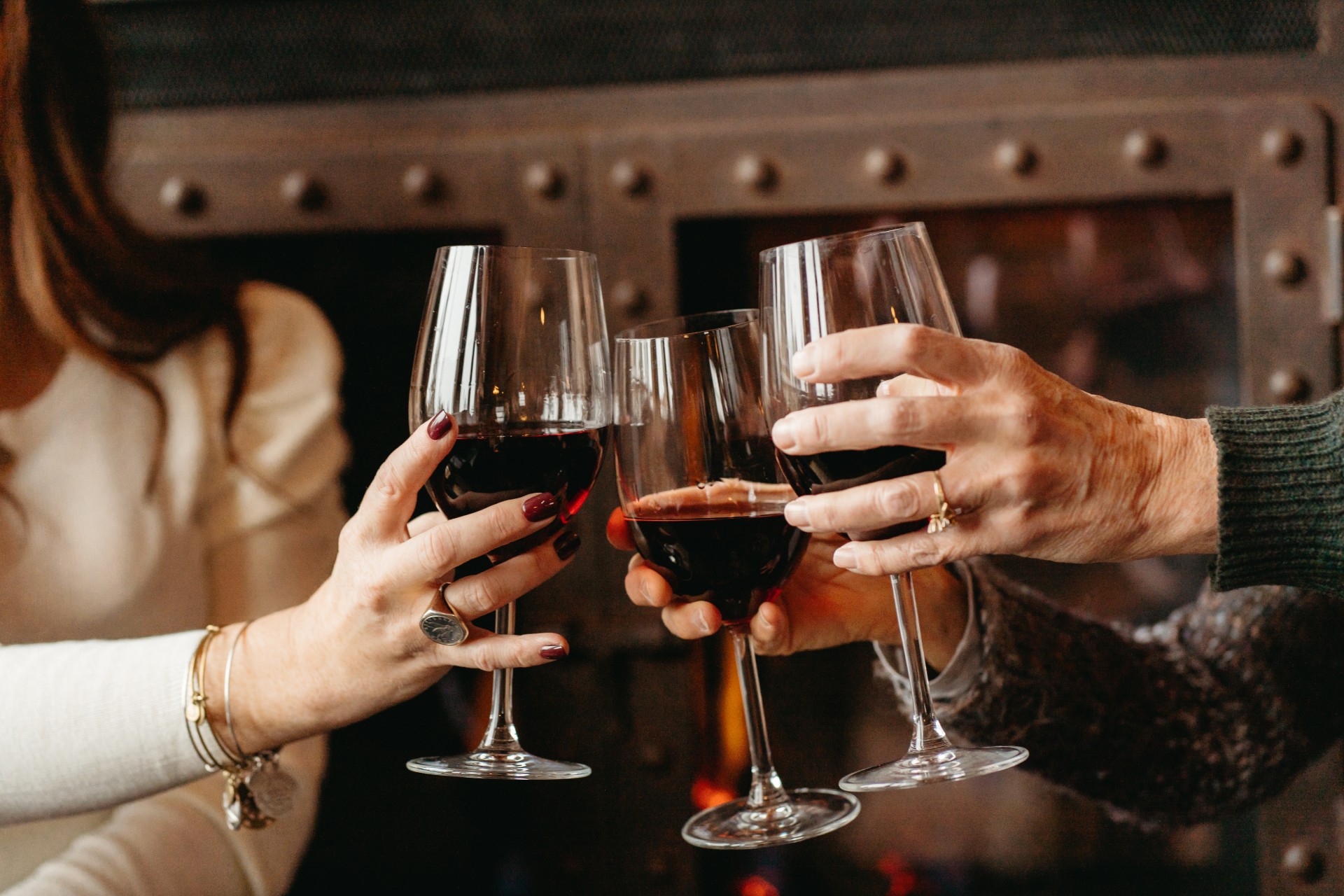 a group of people holding wine glasses