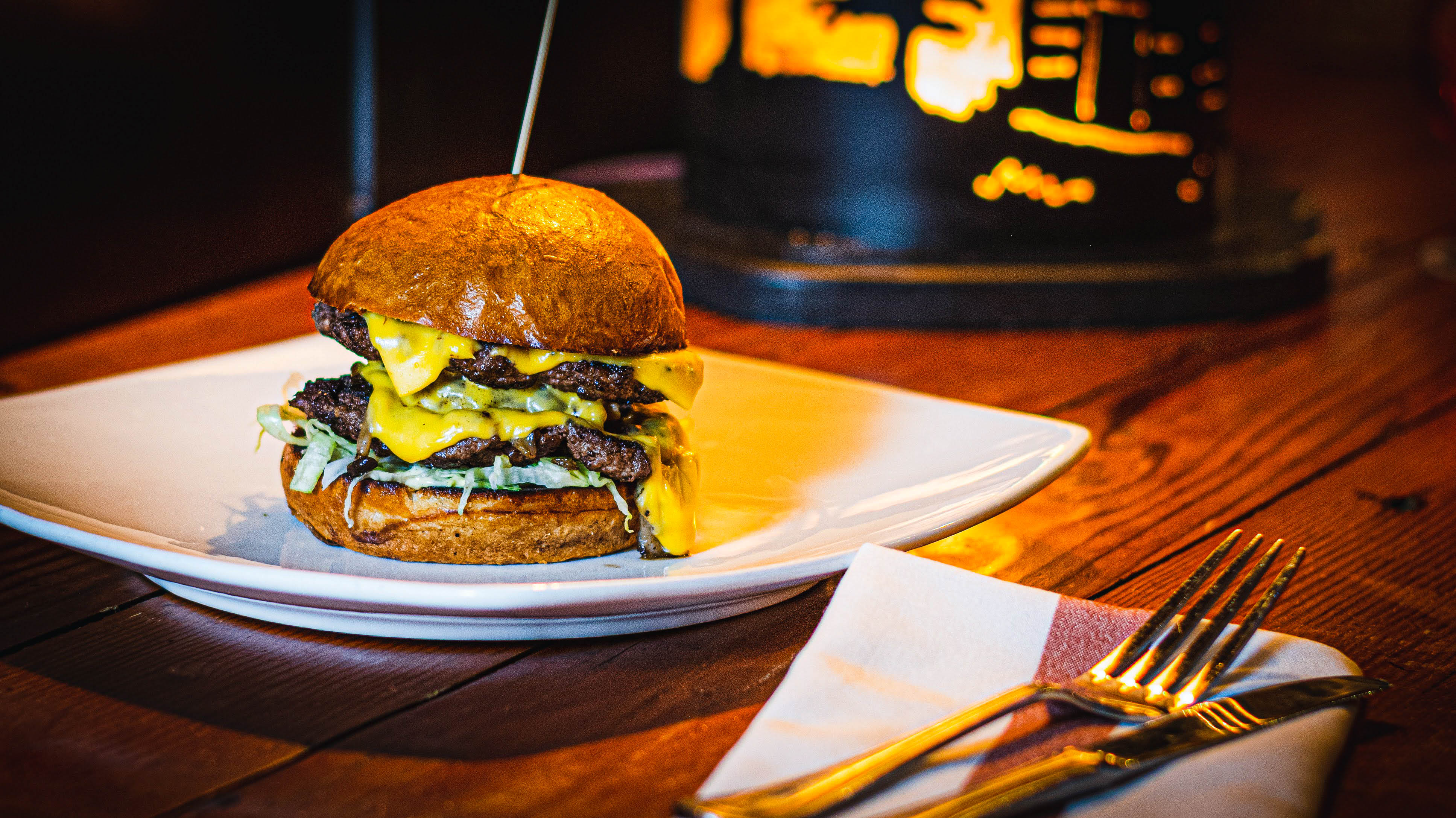 a double cheeseburger on a plate
