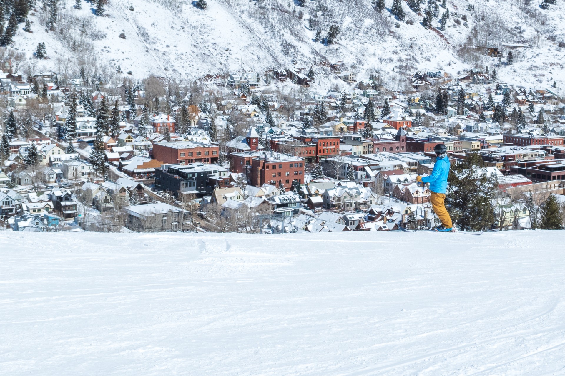 A skier in deep snow at Telluride in March
