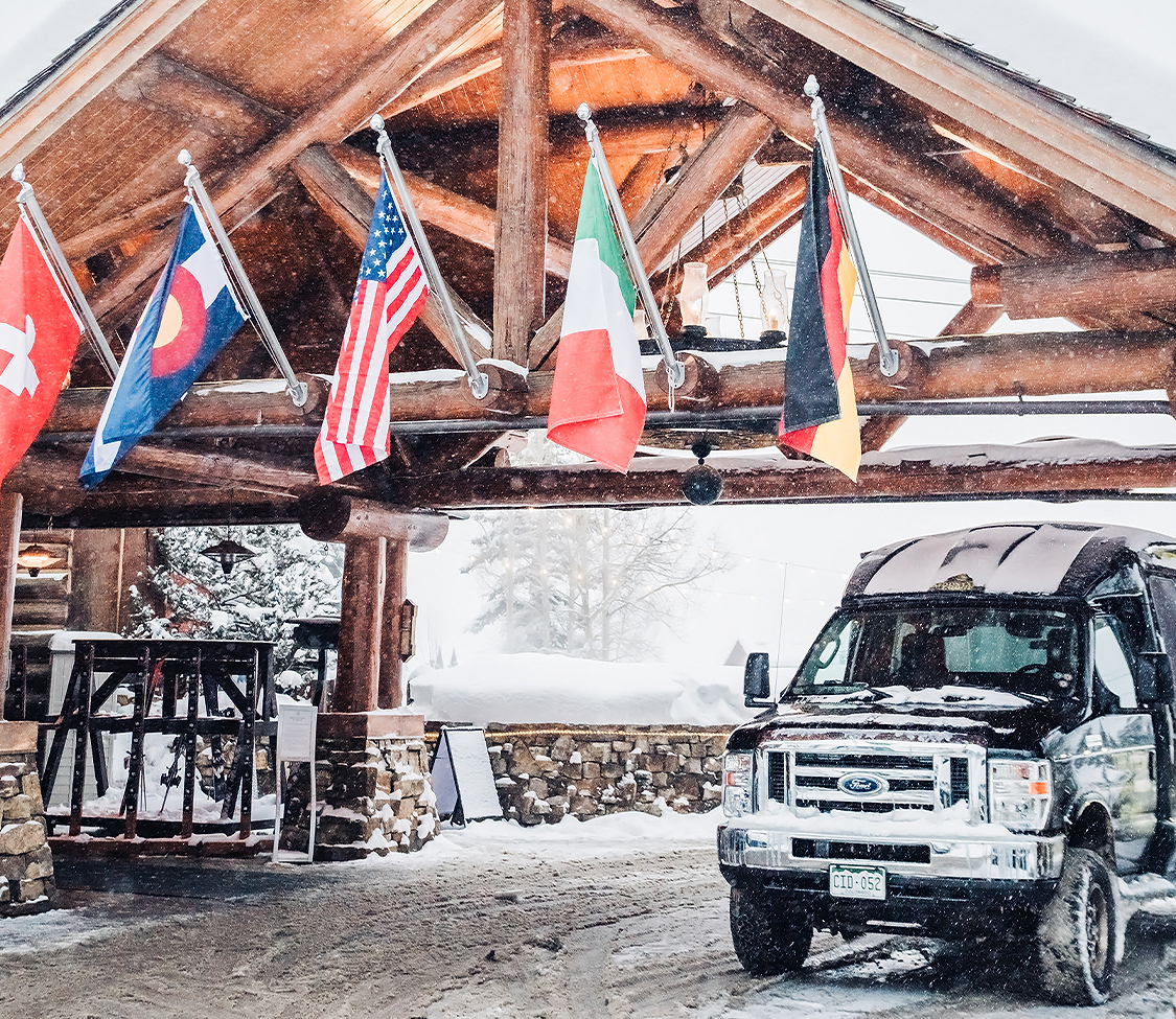 a truck parked under a wooden structure