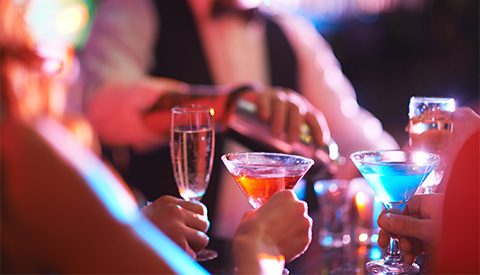 a group of people holding drinks