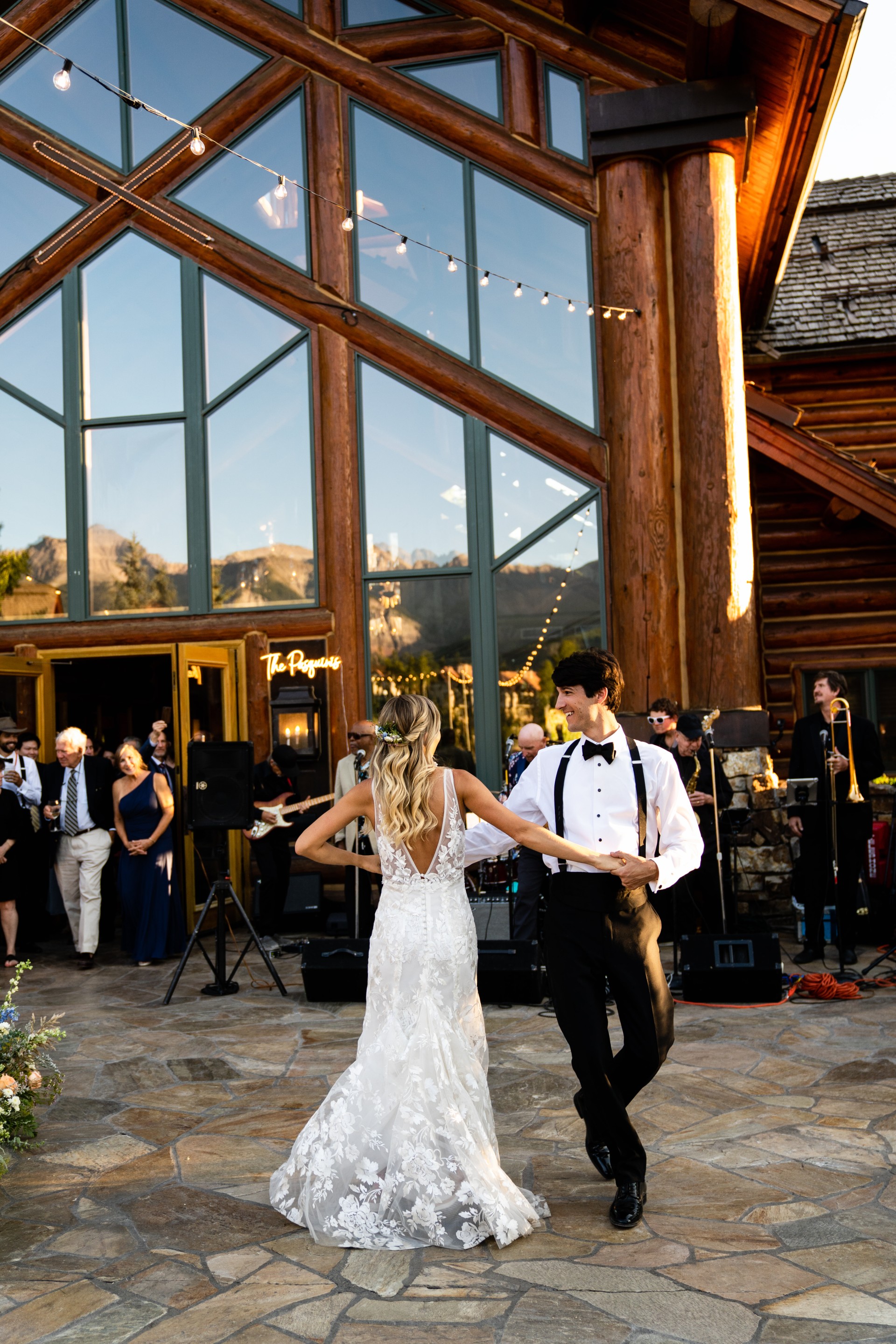 a man and woman dancing outside