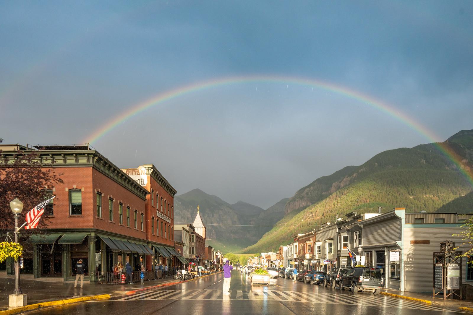 Rainbow over the town of Telluride and Colorado Avenue