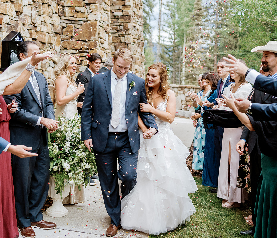 a man and woman walking down a aisle