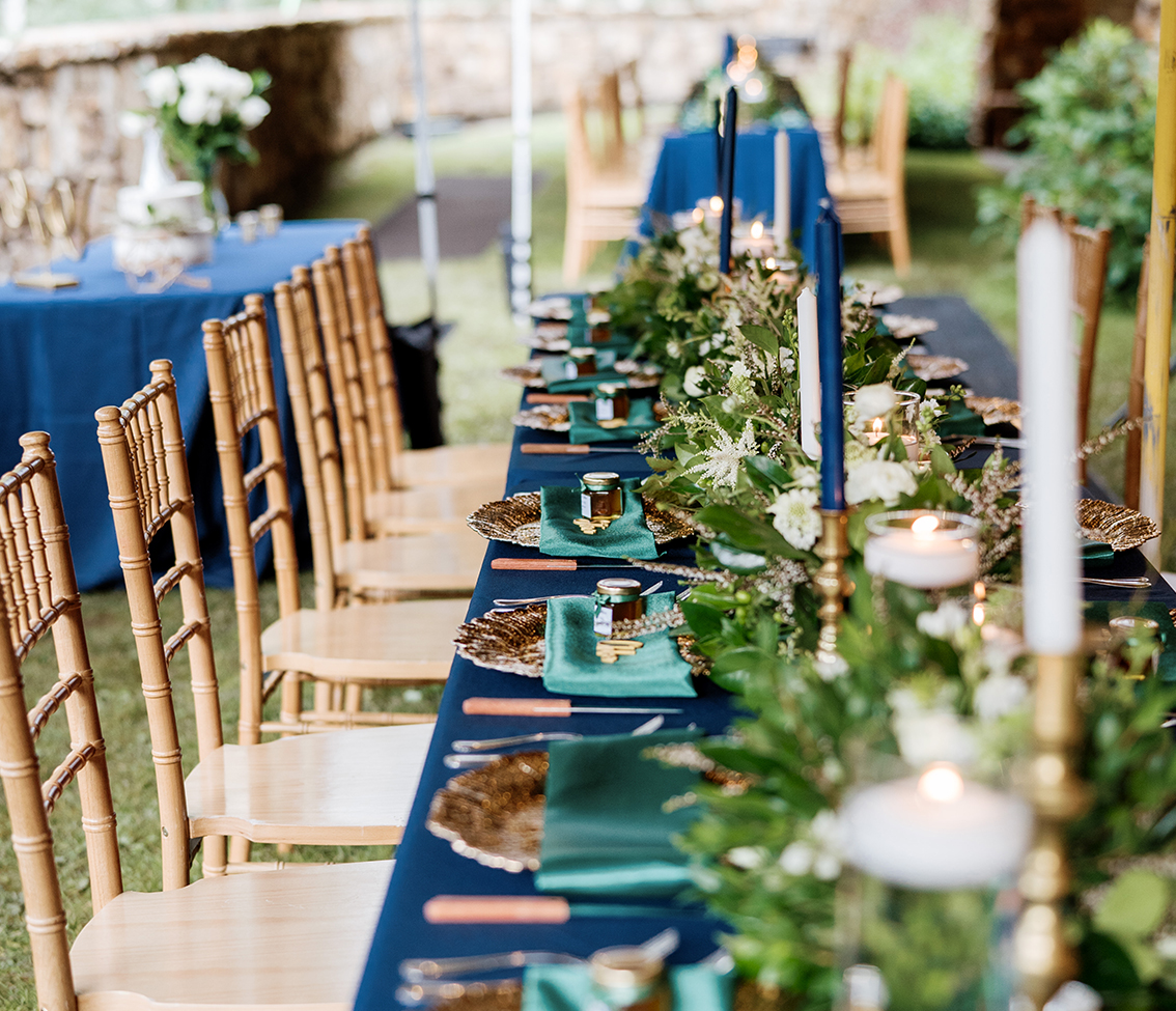 a table with chairs and candles