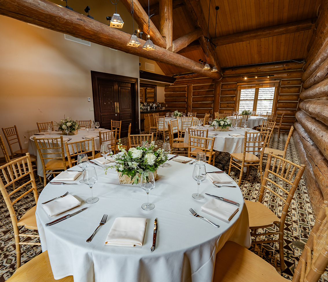 a large dining room with tables set