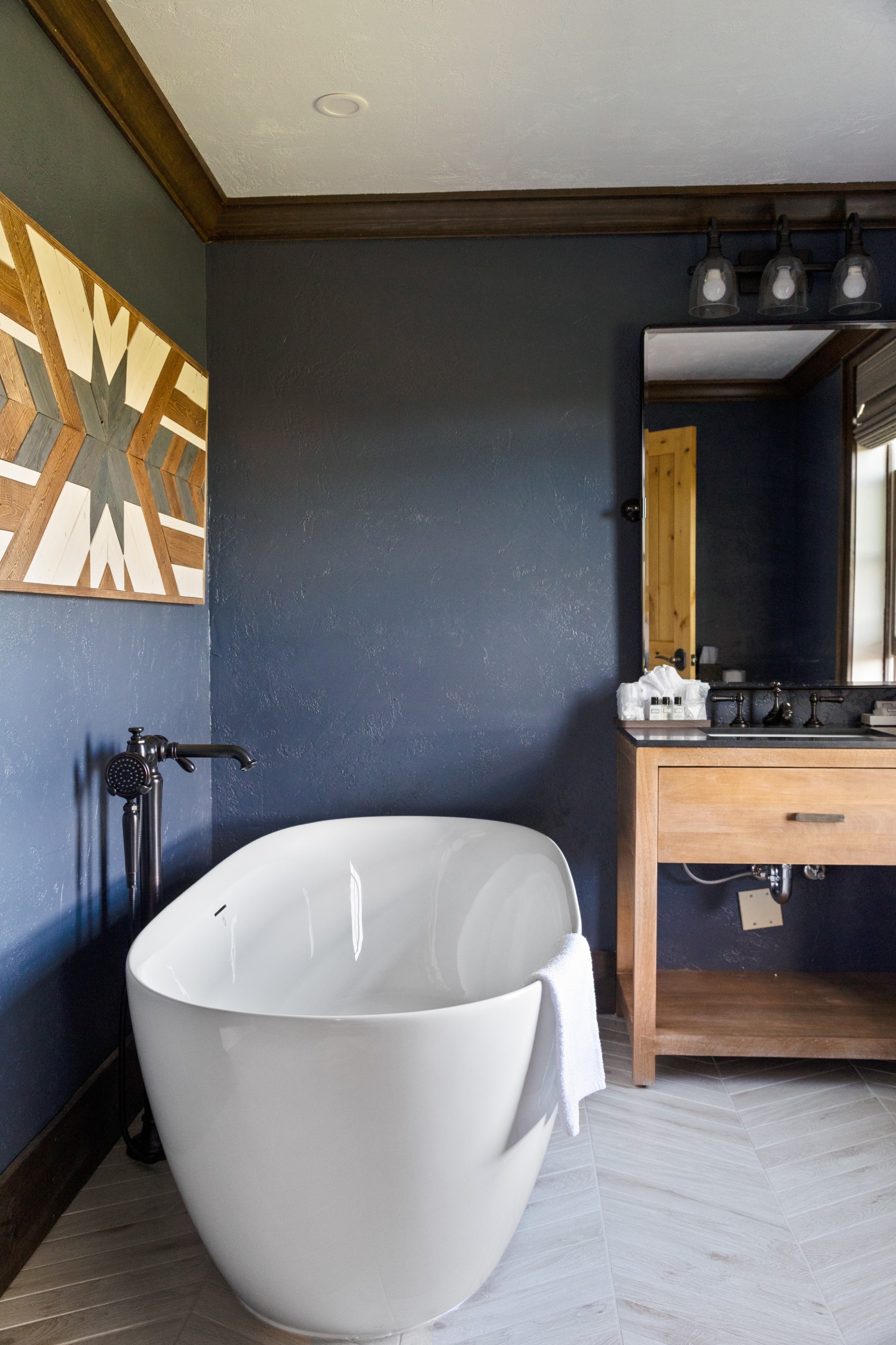 a bathroom with a white tub and a sink
