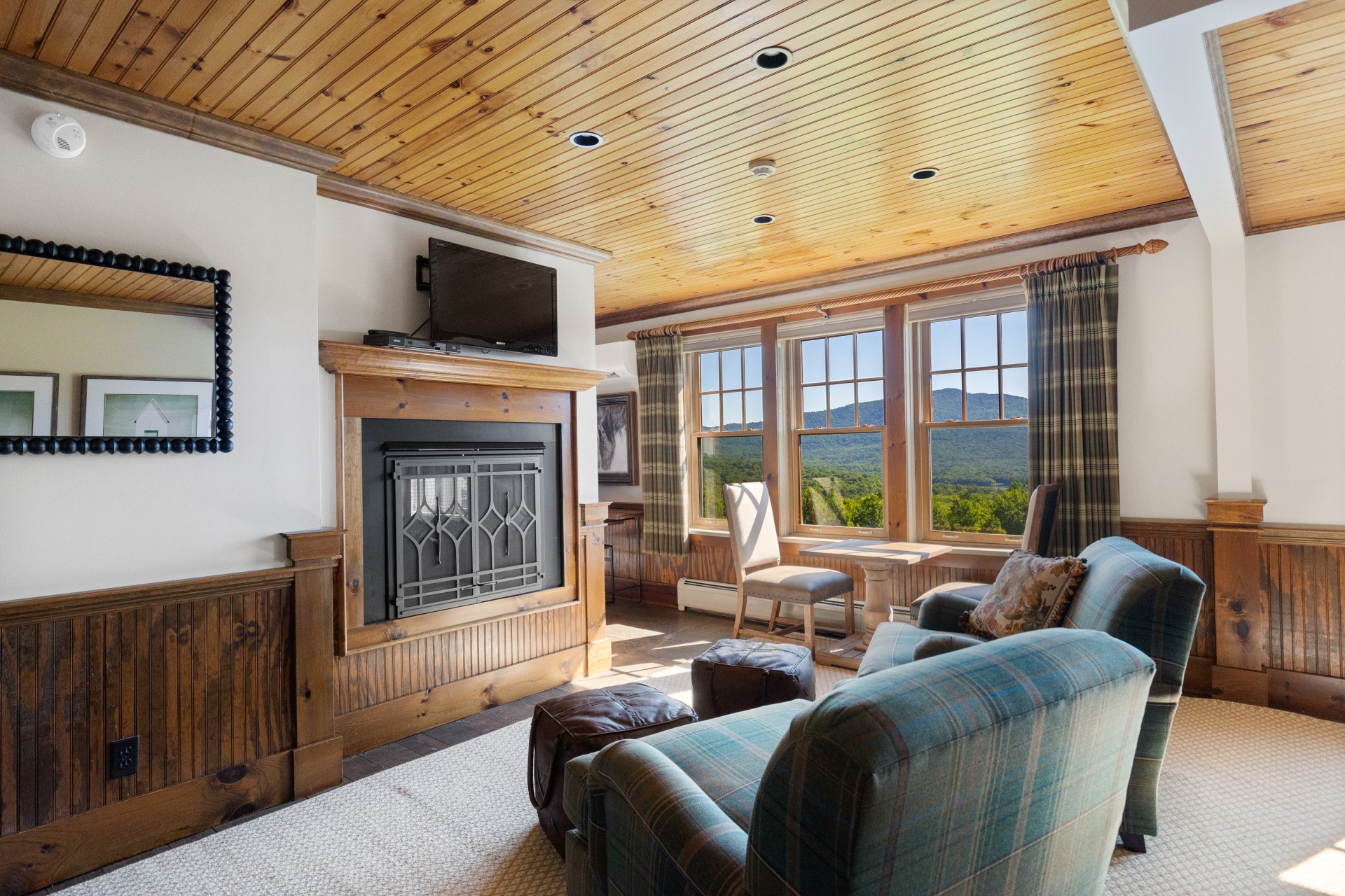 a living room with a fireplace and couches