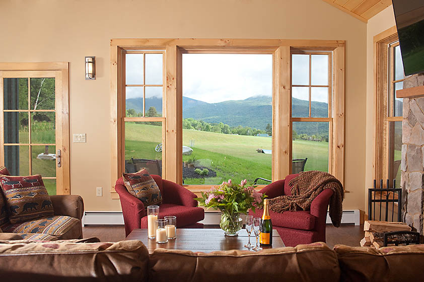 a living room with a view of the mountains