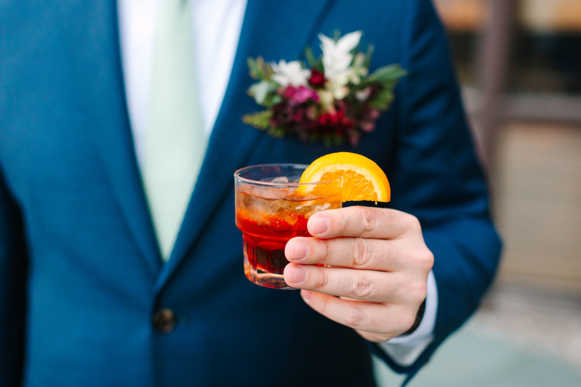 a man holding a drink