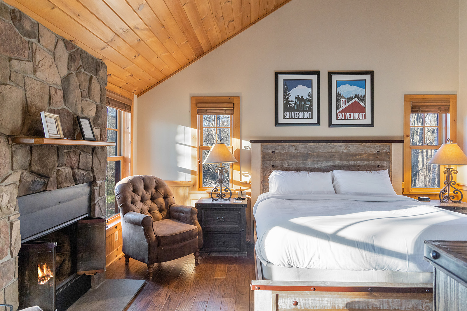 a bedroom with a fireplace and a bed