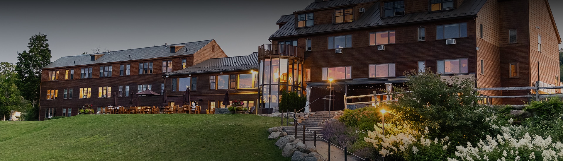 a large building with a glass door and stairs leading up to it
