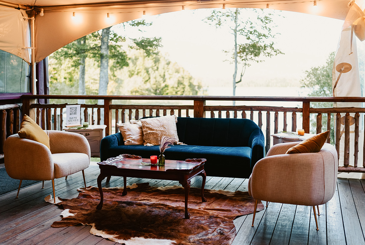a couches and a coffee table on a deck