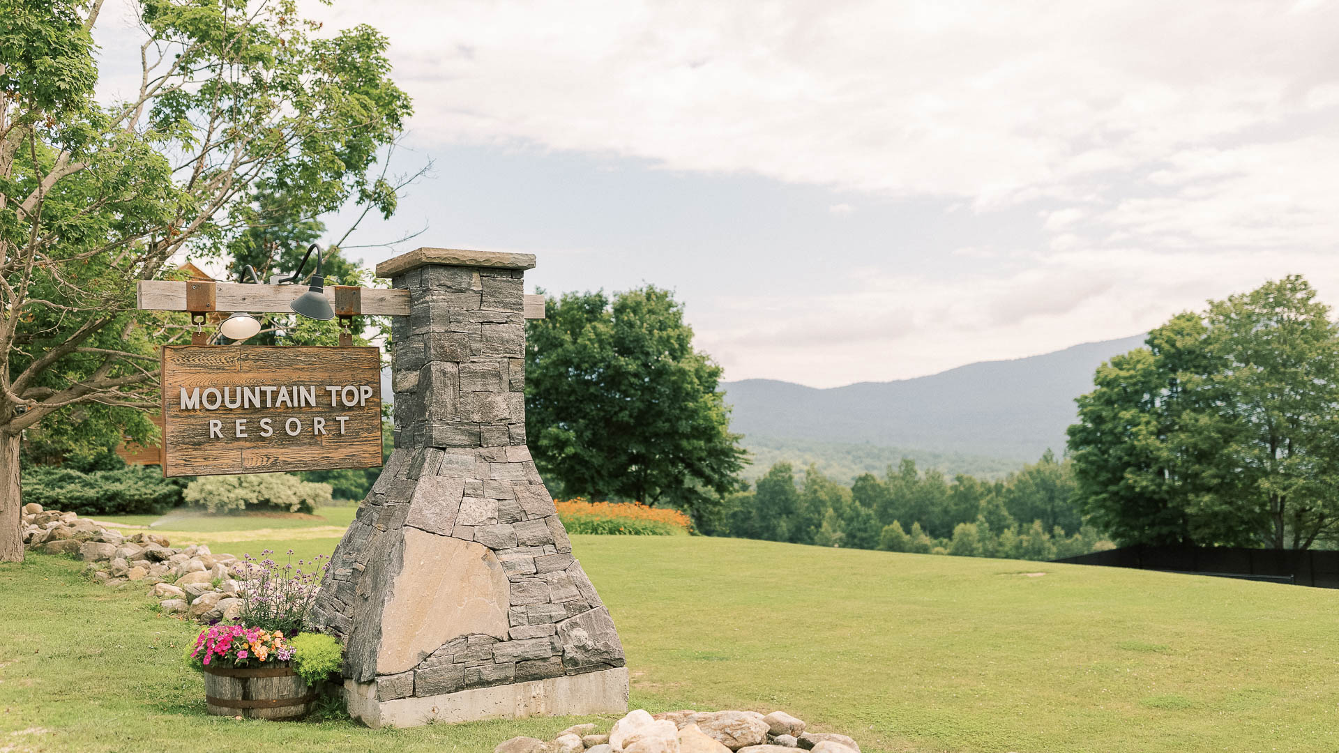 a sign on a stone post