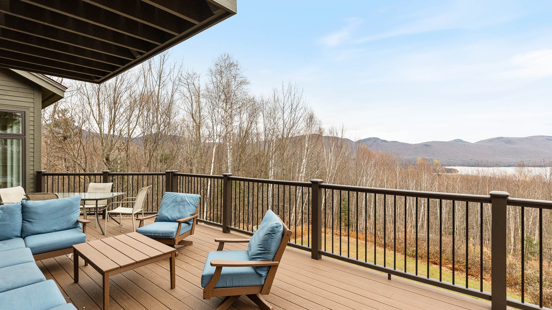 a deck with chairs and a table