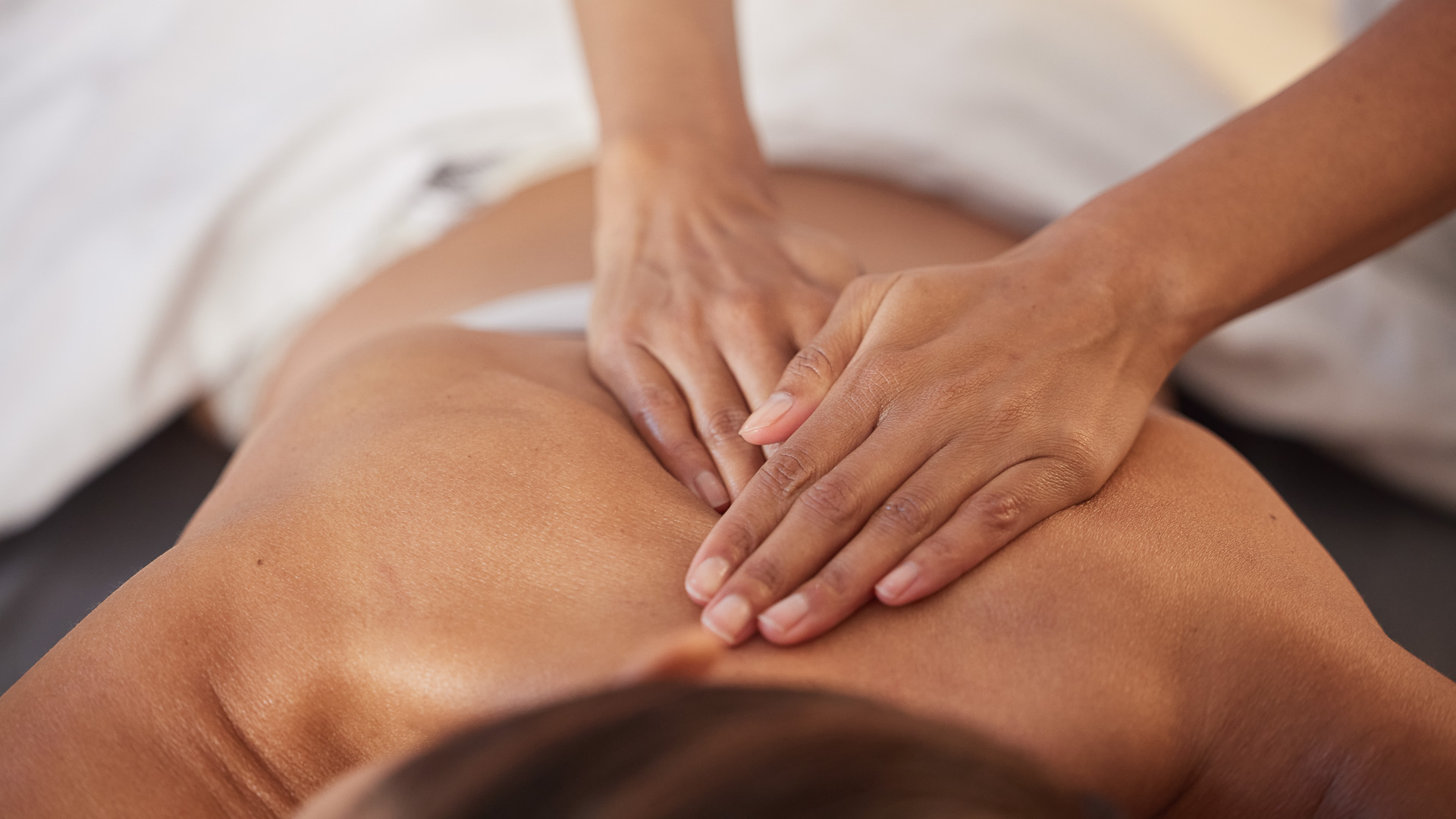 a person receiving a back massage