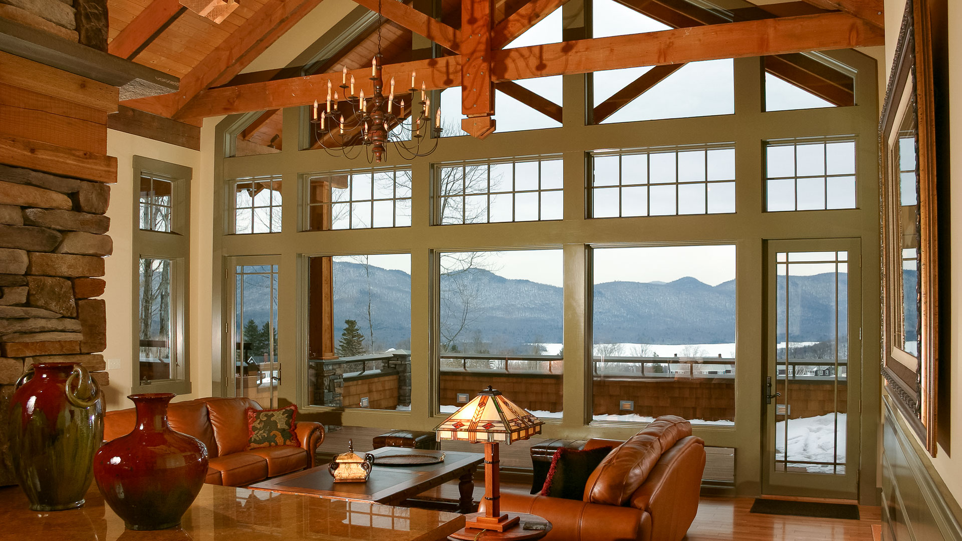 a living room with a chandelier and couches
