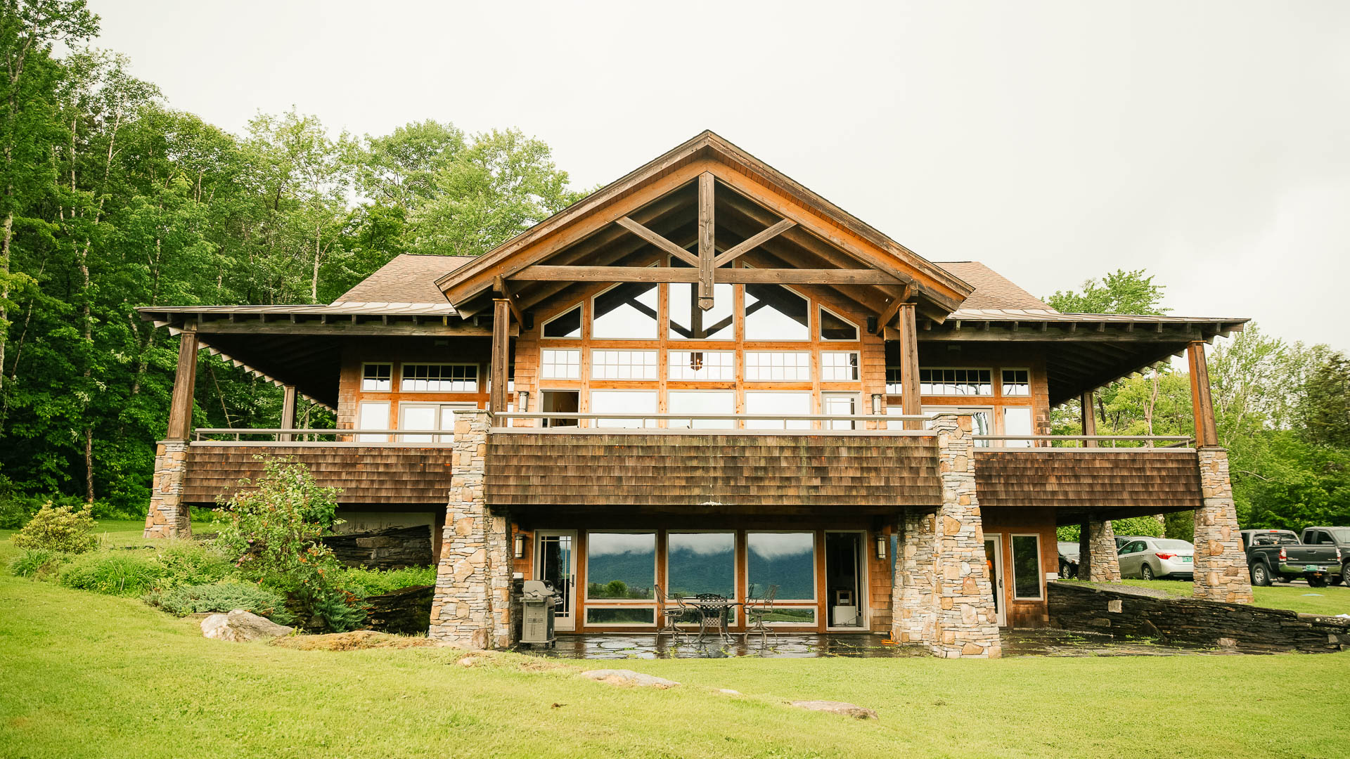 a large house with a large porch and a large lawn
