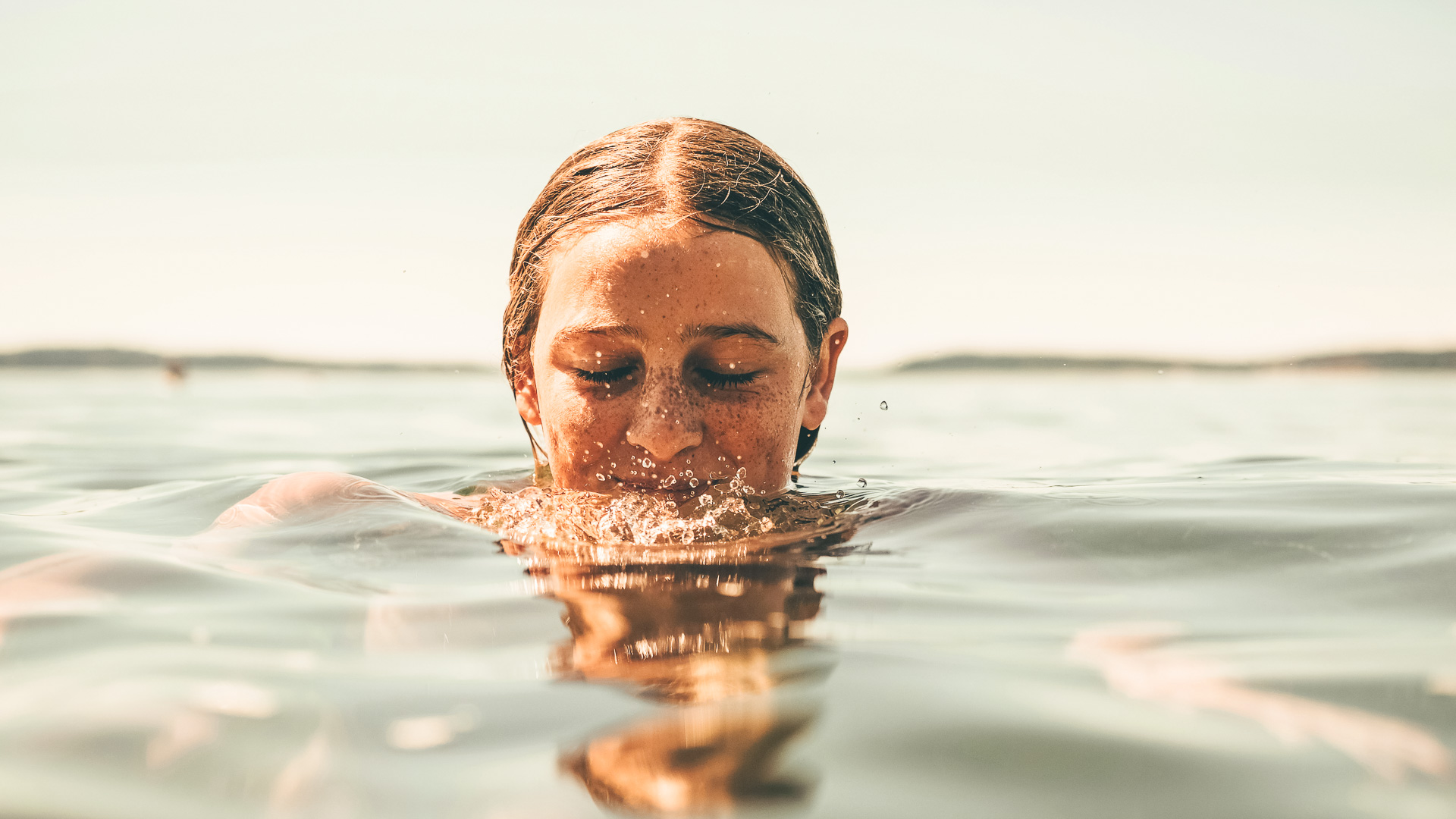 a woman swimming in water