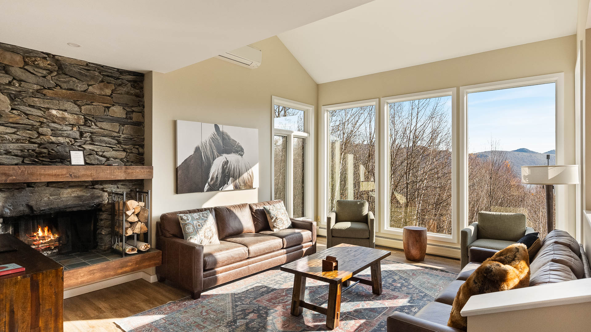 a living room with a fireplace and couches
