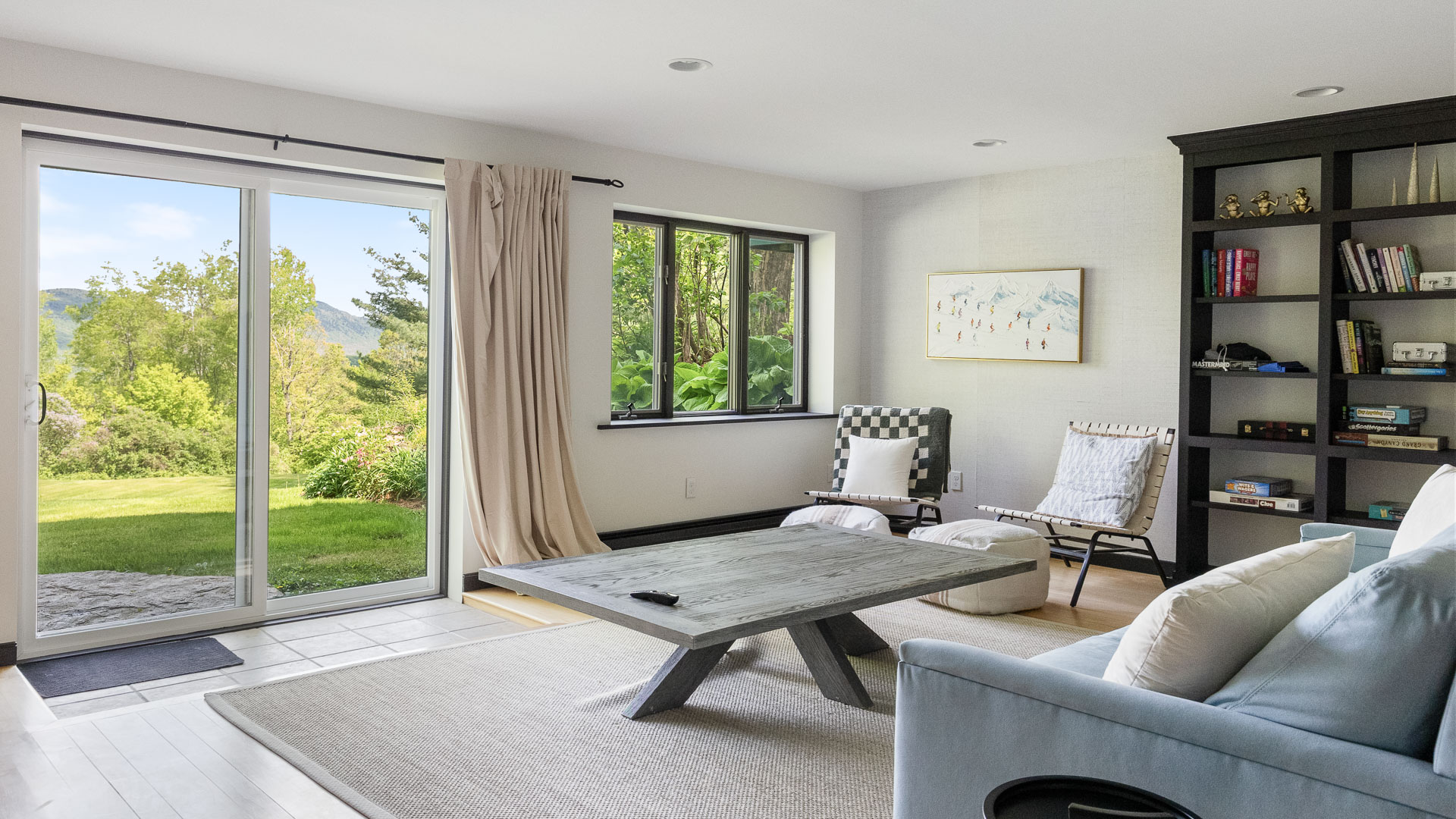 a living room with a table and chairs