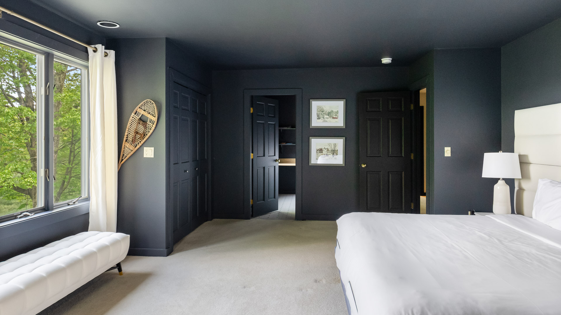 a bedroom with a bed and a door