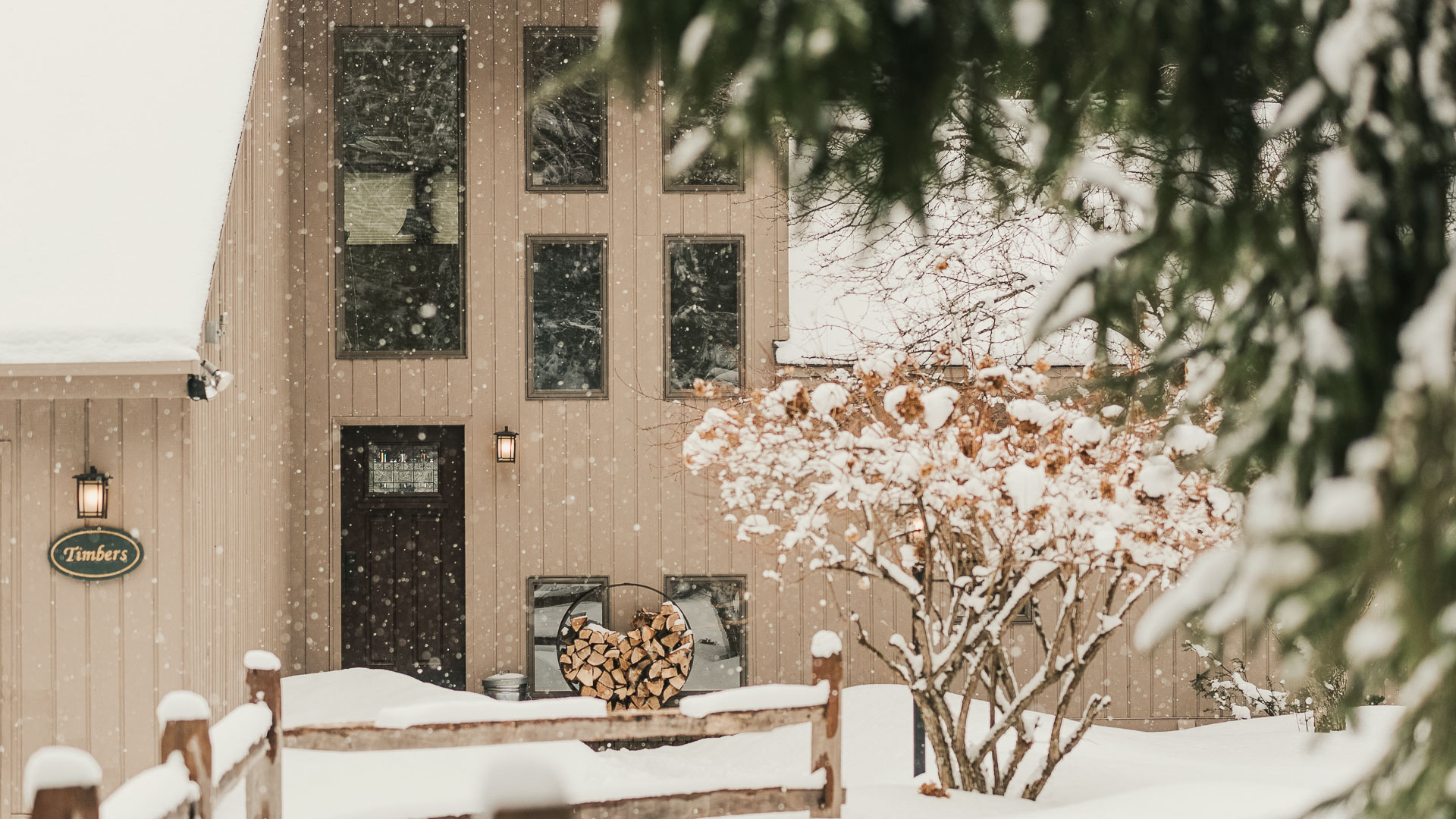 a house with snow falling