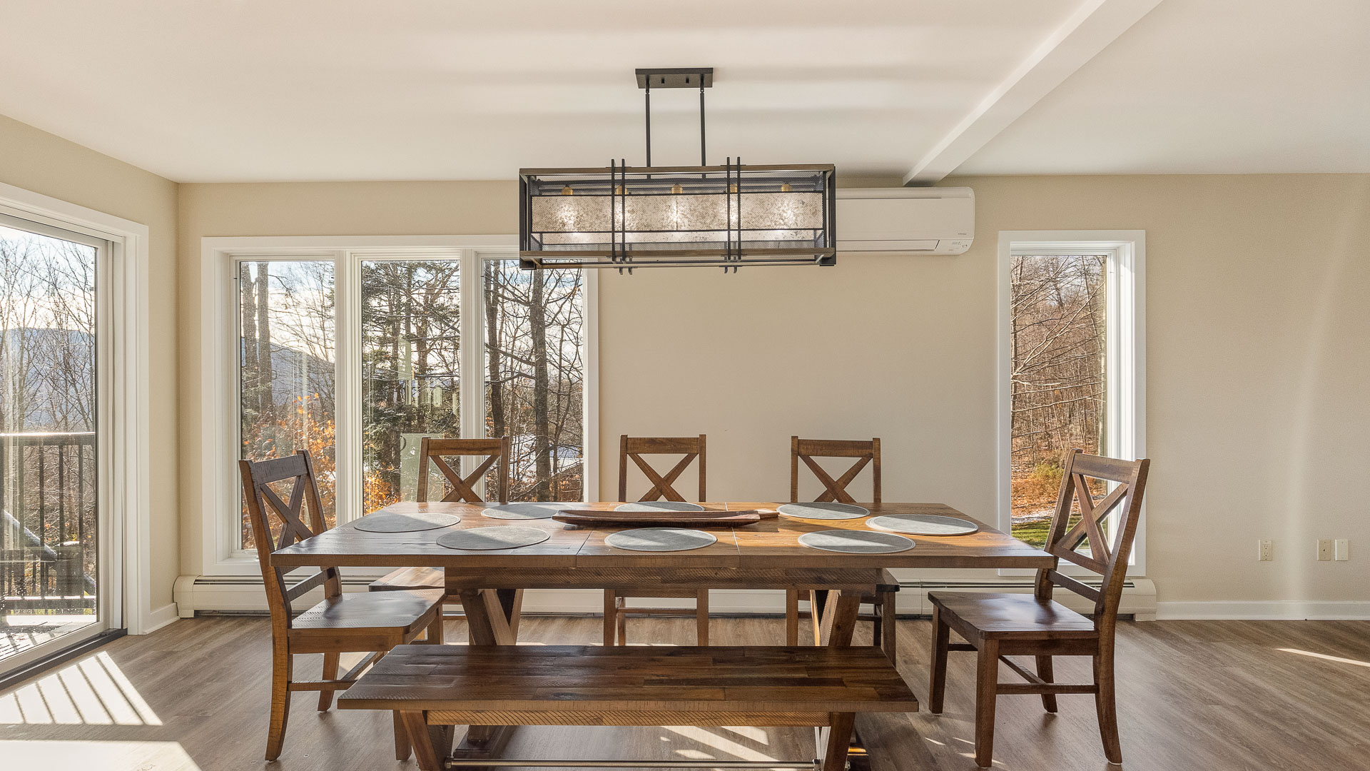 a dining room with a table and chairs