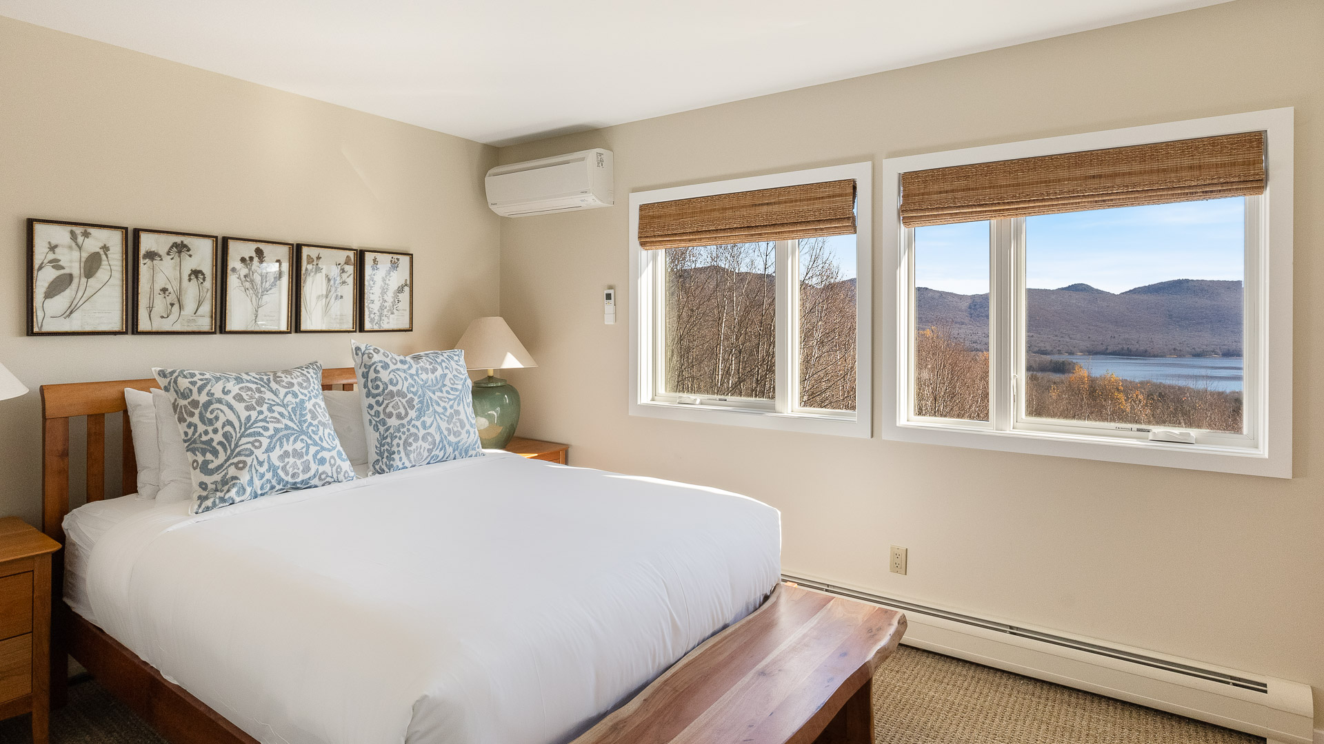 a bedroom with a bed and windows