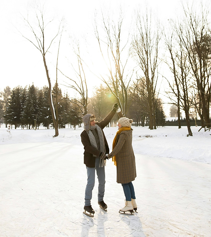a man and woman ice skating