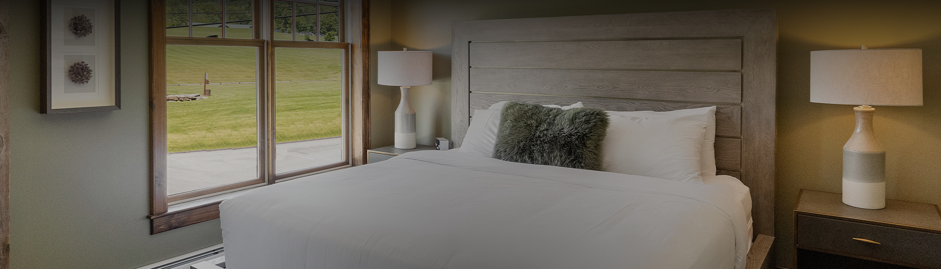 a bed with a lamp and a pillow