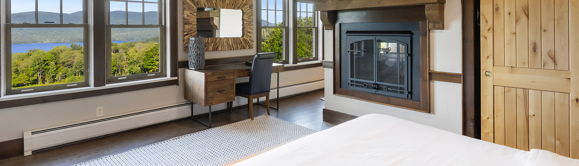 a room with a fireplace and a desk