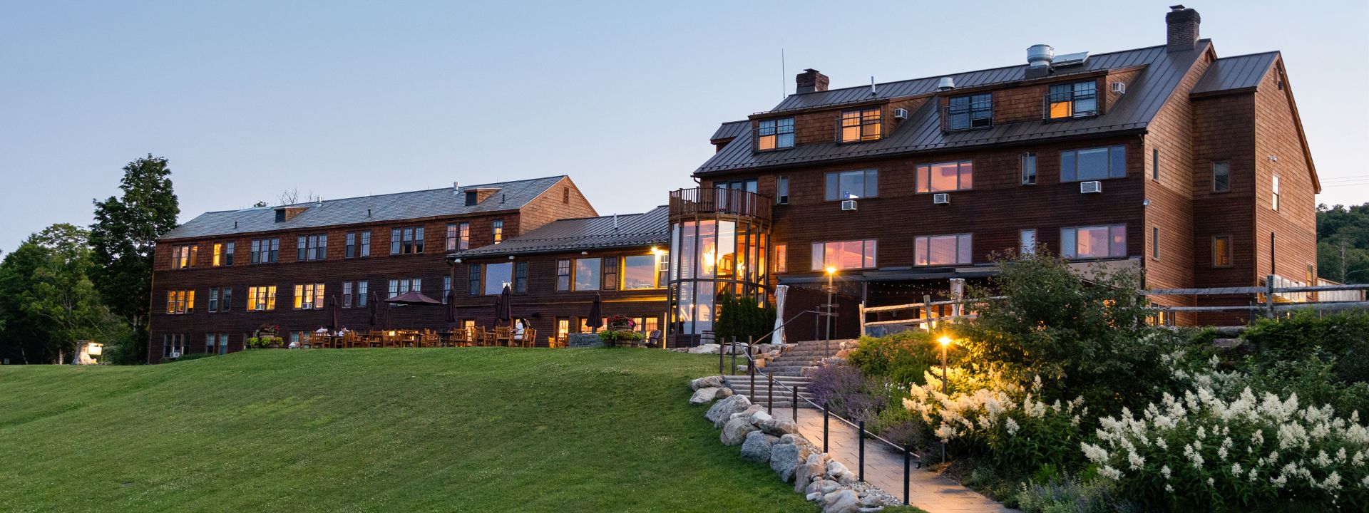 a building with a lawn and stairs