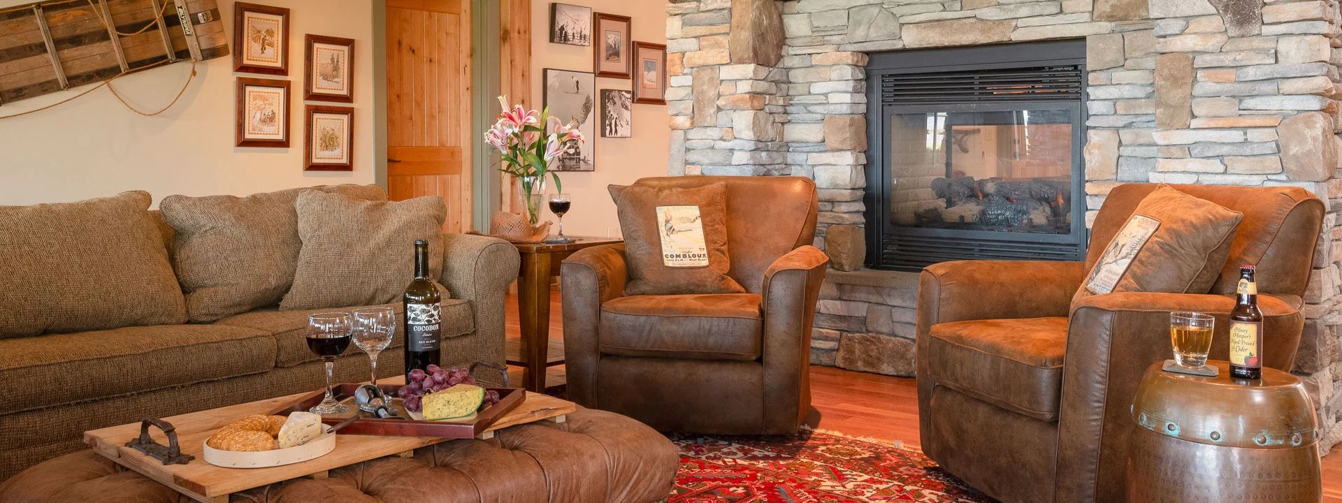 a living room with a fireplace and chairs