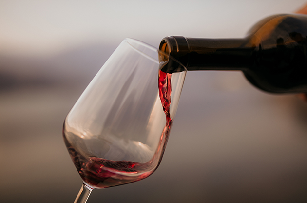 a wine being poured into a glass
