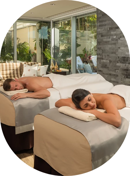 a man and woman lying on beds