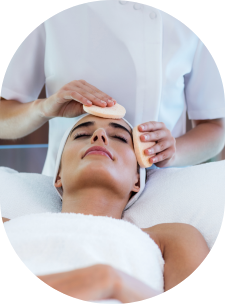 a woman receiving a face massage