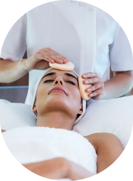 a woman receiving a face massage