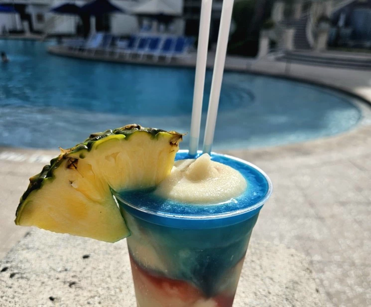 a drink with a pineapple slice on top of it