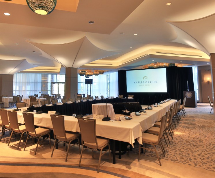 a room with a large table and chairs