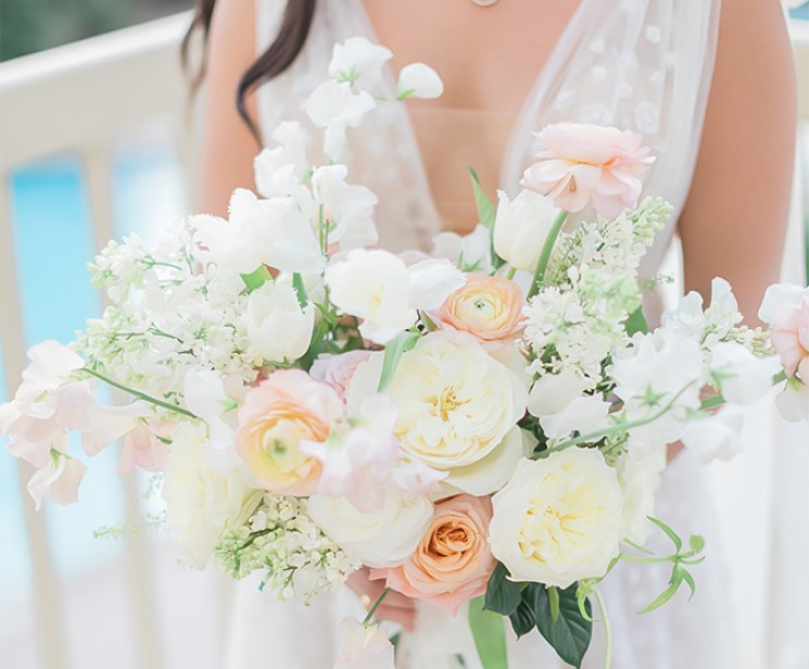 a woman holding a bouquet of flowers