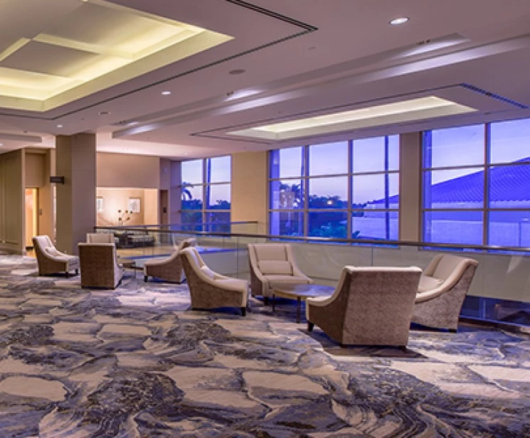 a room with chairs and a window