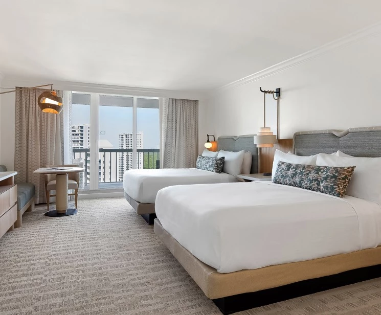 a hotel room with two beds