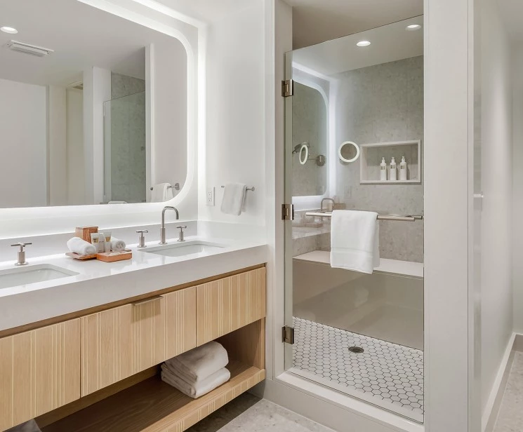 a bathroom with a shower and a sink